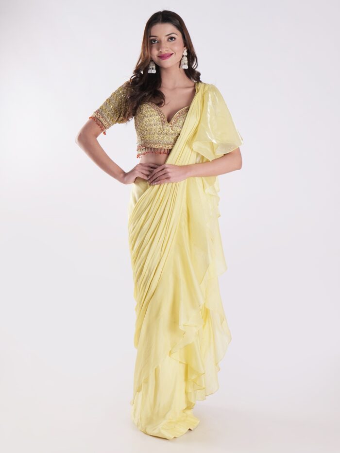 Vibrant Yellow Saree With A Ruffled Design And Golden Embellished Blouse With A Plunging Neckline - Image 1