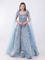 Radiate Royal Elegance In This Stunning Icy Blue Embroidered Gown with Cape Sleeves