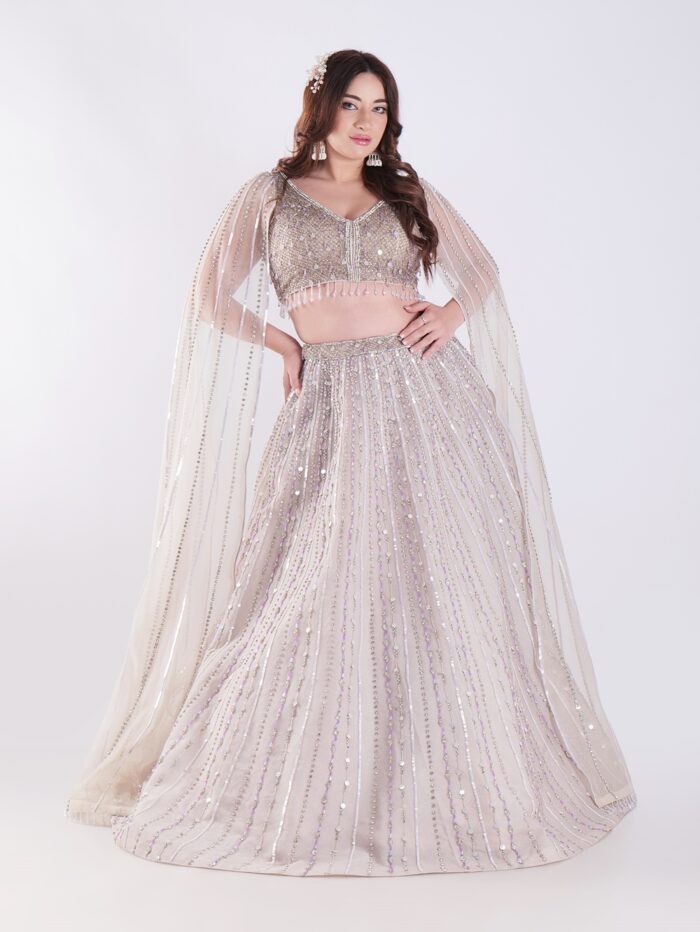 1-5.jpg Light Colored Embrace Regal Elegance in This Champagne Sequin Embellished Lehenga Set - Image 1