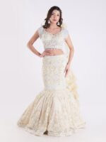 White And Cream Colored Heavily Embellished With A Sheer Dupatta Fish Cut Lehenga Set