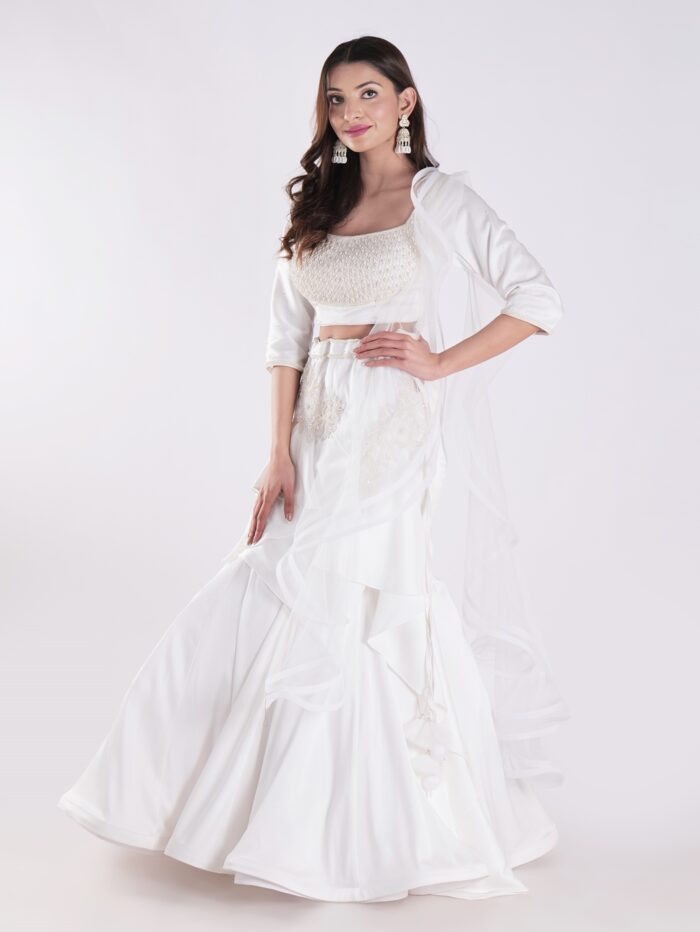 White Flowing Intricate Layers Of Ruffles Dramatic And Elegant Silhouette Cocktail Lehenga Set - Image 3
