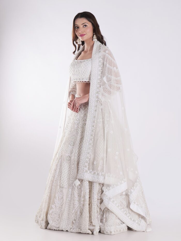 Heavily Embellished With Sequins And Pearls Creating A White Shimmering Effect Bridal Lehenga Choli - Image 3