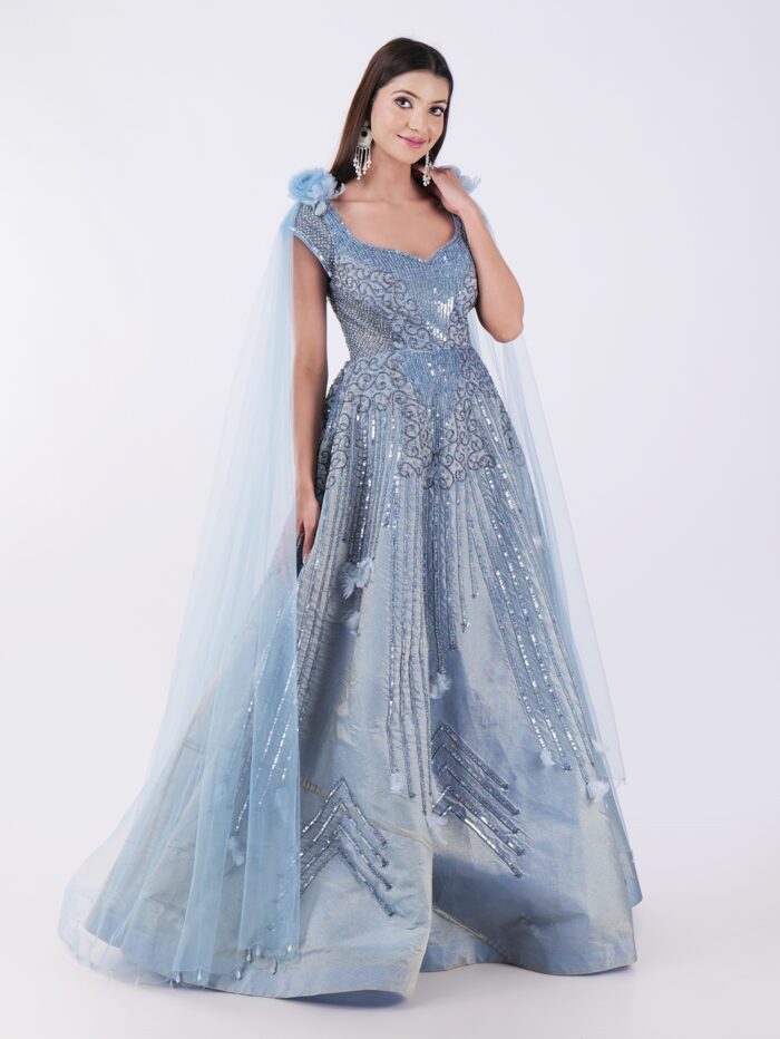 Radiate Royal Elegance In This Stunning Icy Blue Embroidered Gown with Cape Sleeves - Image 4