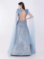 Radiate Royal Elegance In This Stunning Icy Blue Embroidered Gown with Cape Sleeves - Image 5