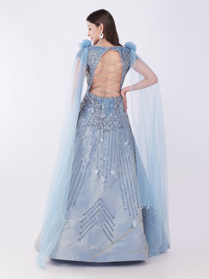 Radiate Royal Elegance In This Stunning Icy Blue Embroidered Gown with Cape Sleeves - Image 5