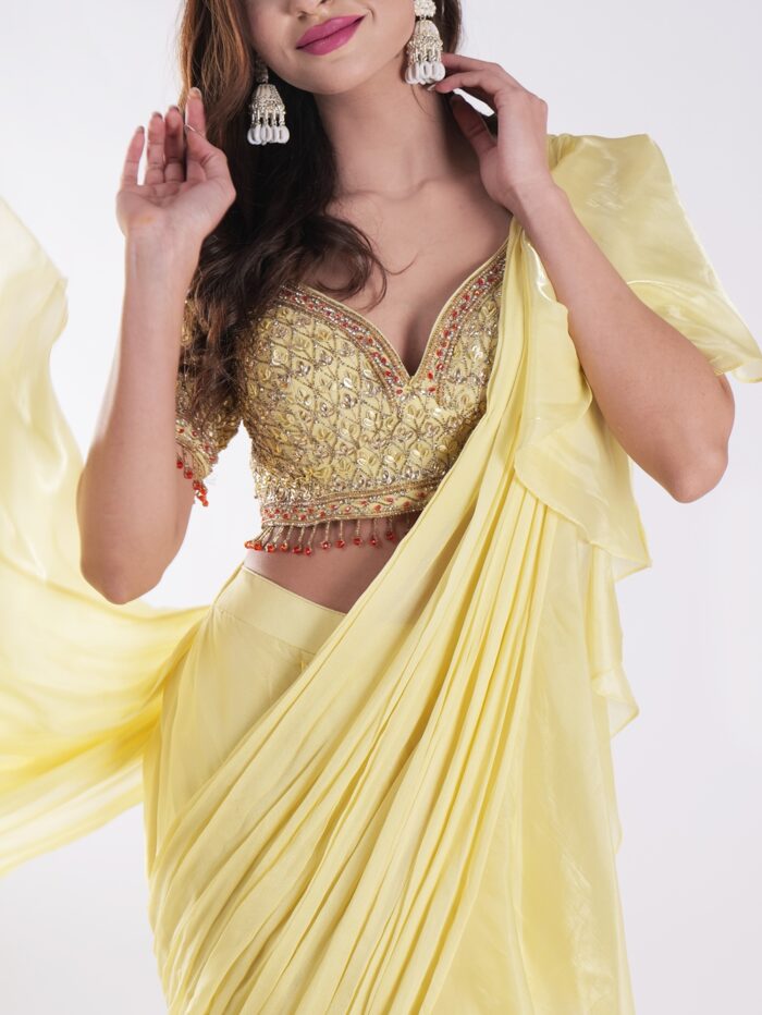 Vibrant Yellow Saree With A Ruffled Design And Golden Embellished Blouse With A Plunging Neckline - Image 6