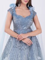 Radiate Royal Elegance In This Stunning Icy Blue Embroidered Gown with Cape Sleeves - Image 6