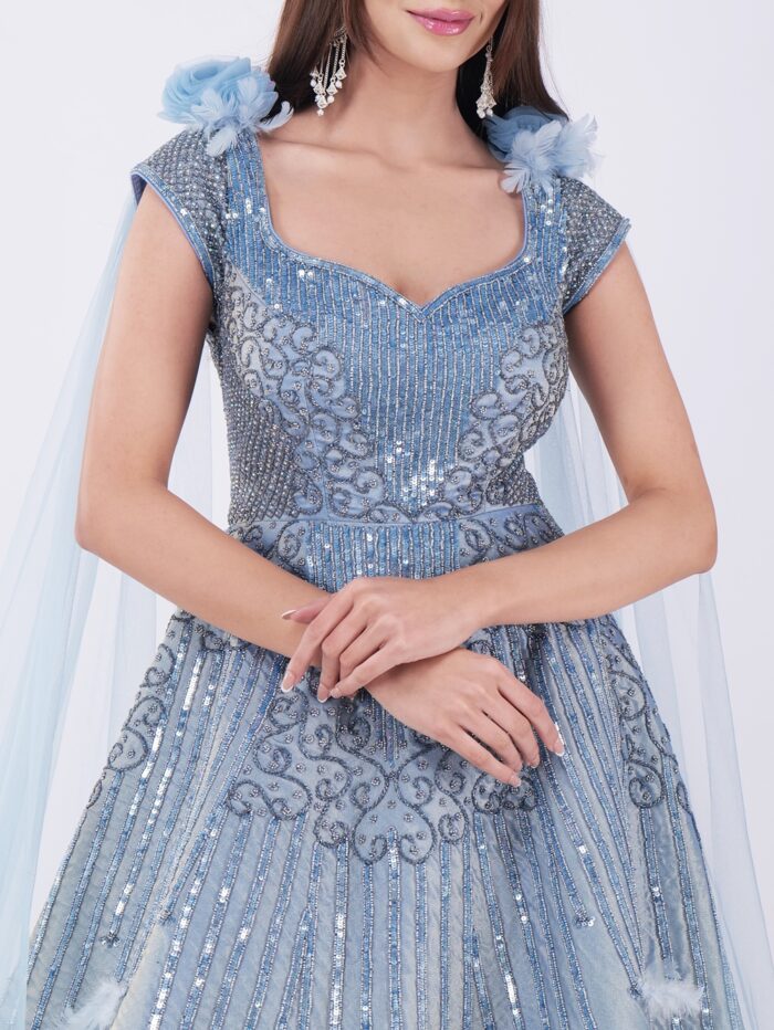 Radiate Royal Elegance In This Stunning Icy Blue Embroidered Gown with Cape Sleeves - Image 6